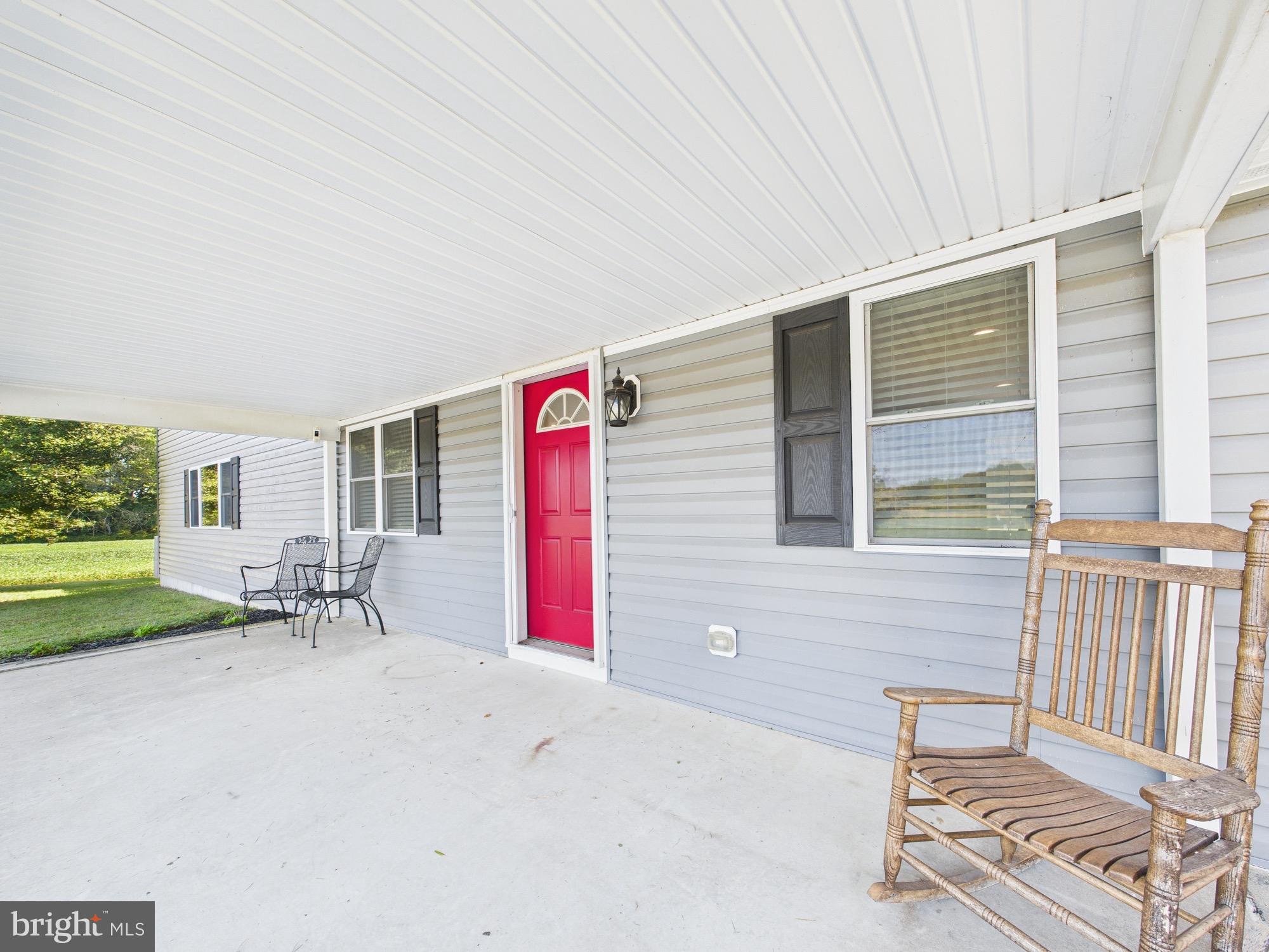 15551 Wharton Road Goldsboro, MD 21636 - Photo 63 of 80 a view of a house with backyard and a sitting area