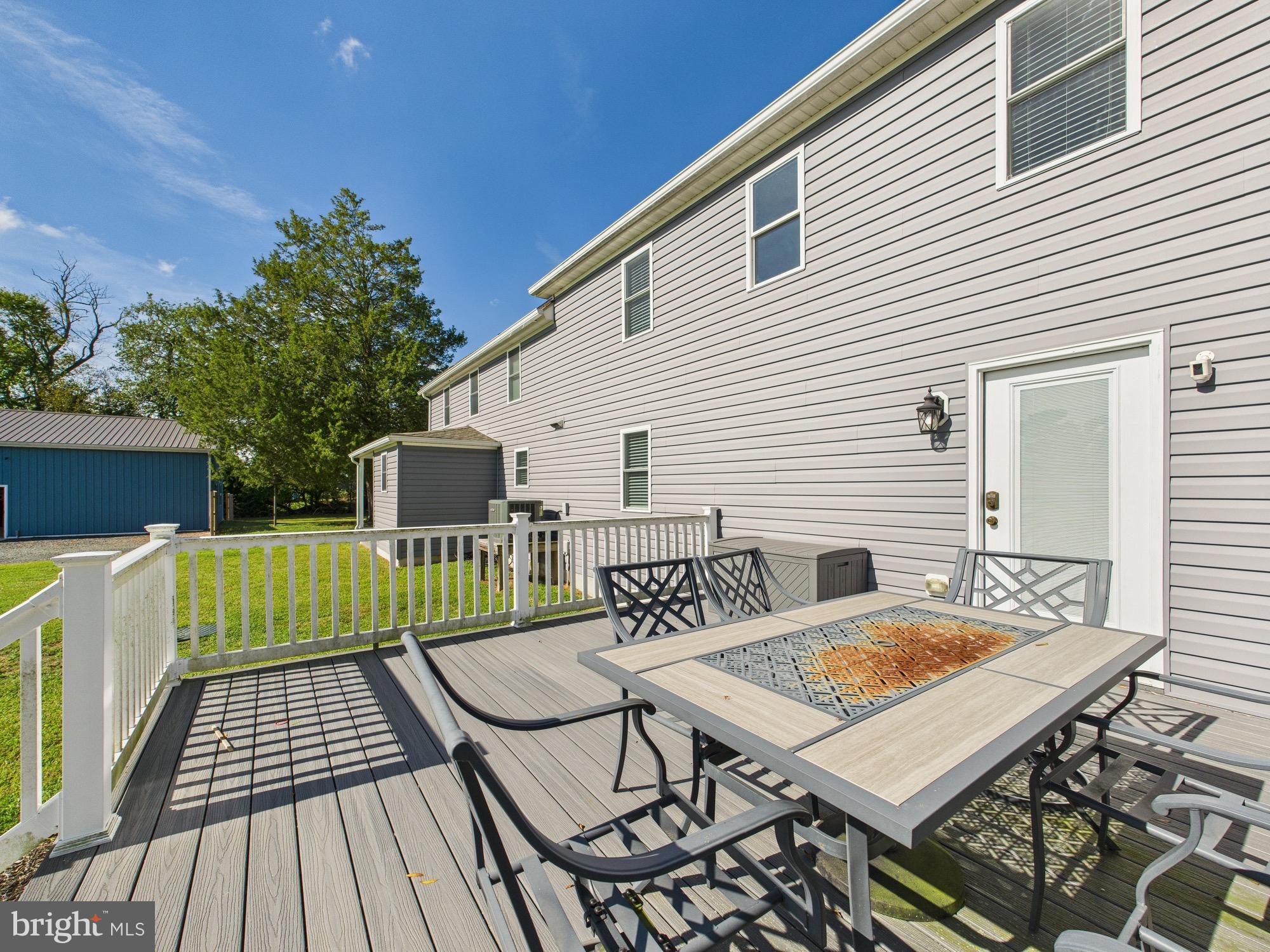 15551 Wharton Road Goldsboro, MD 21636 - Photo 68 of 80 a view of a wooden deck with furniture