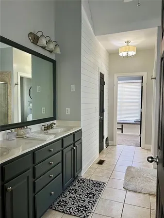 a kitchen with stainless steel appliances granite countertop a stove and a white cabinets