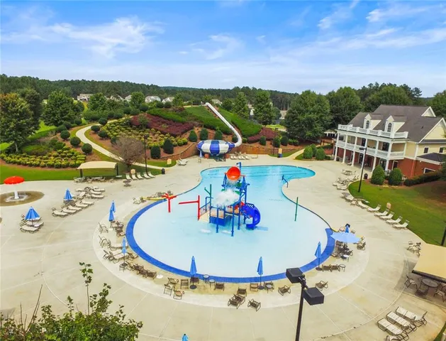 a view of a swimming pool with a patio