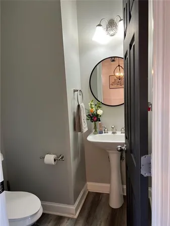 a bathroom with a sink mirror and vanity