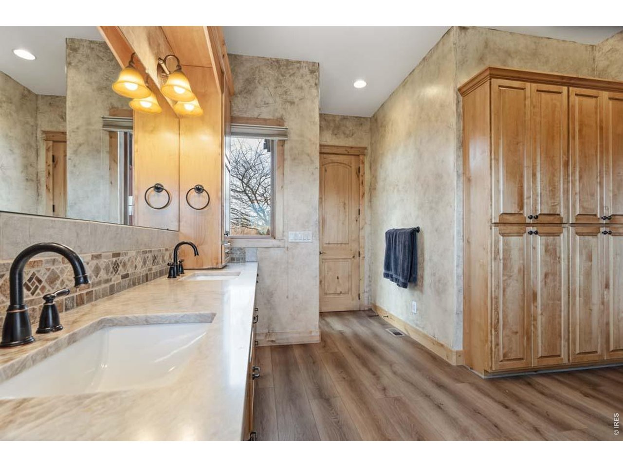 964 Riparian Way Fort Collins, CO 80524 - Photo 33 of 42 a bathroom with a sink and a mirror