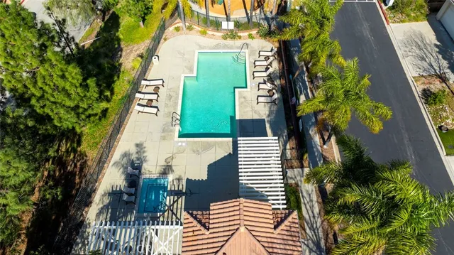 an aerial view of a house with a yard and potted plants