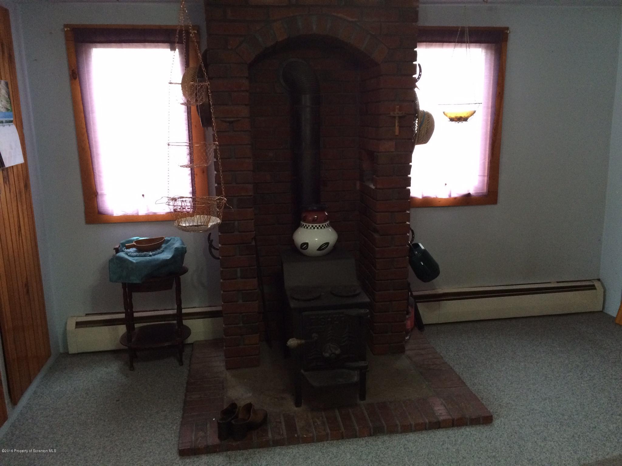 154 Transue Road Laceyville, PA 18623 - Photo 5 of 28 a living room with furniture and a window