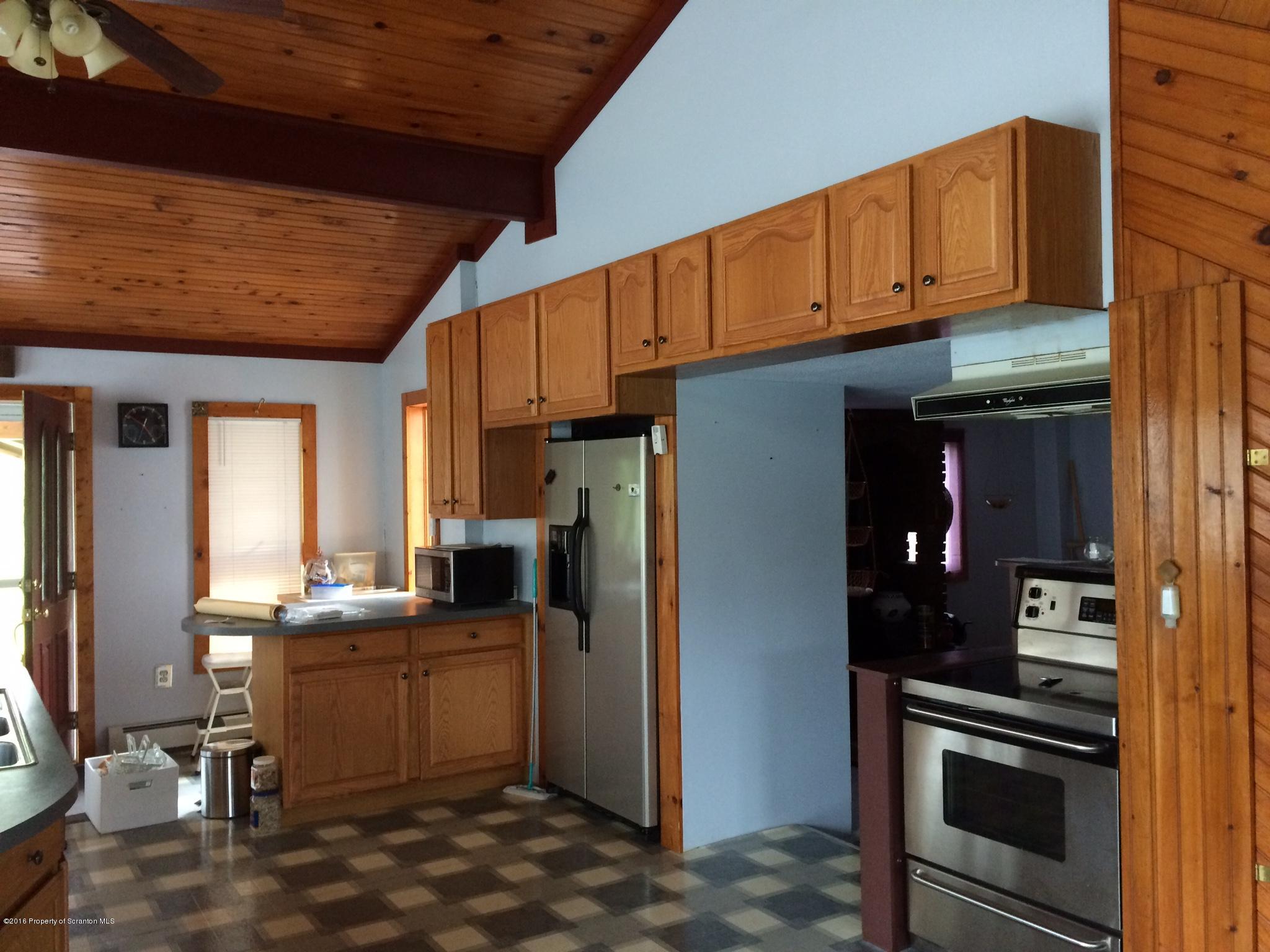 154 Transue Road Laceyville, PA 18623 - Photo 7 of 28 a kitchen with a sink cabinets and appliances