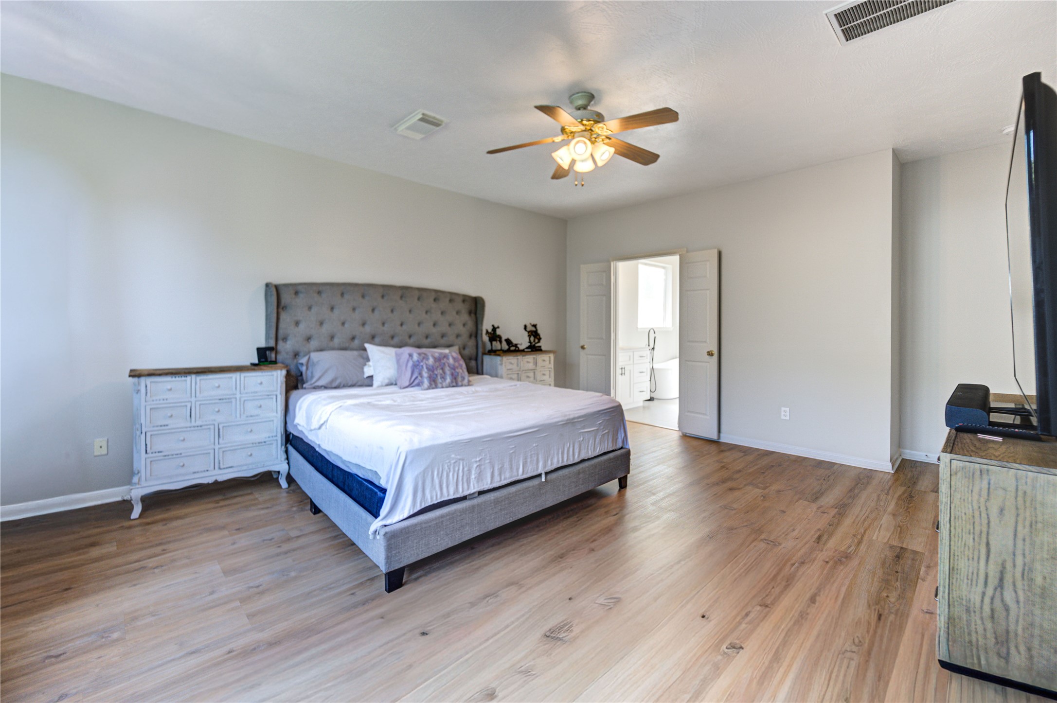 10906 Trail Ridge Drive Houston, TX 77064 - Photo 21 of 41 Carpet-free primary bedroom offering a sleek and low maintenance space.