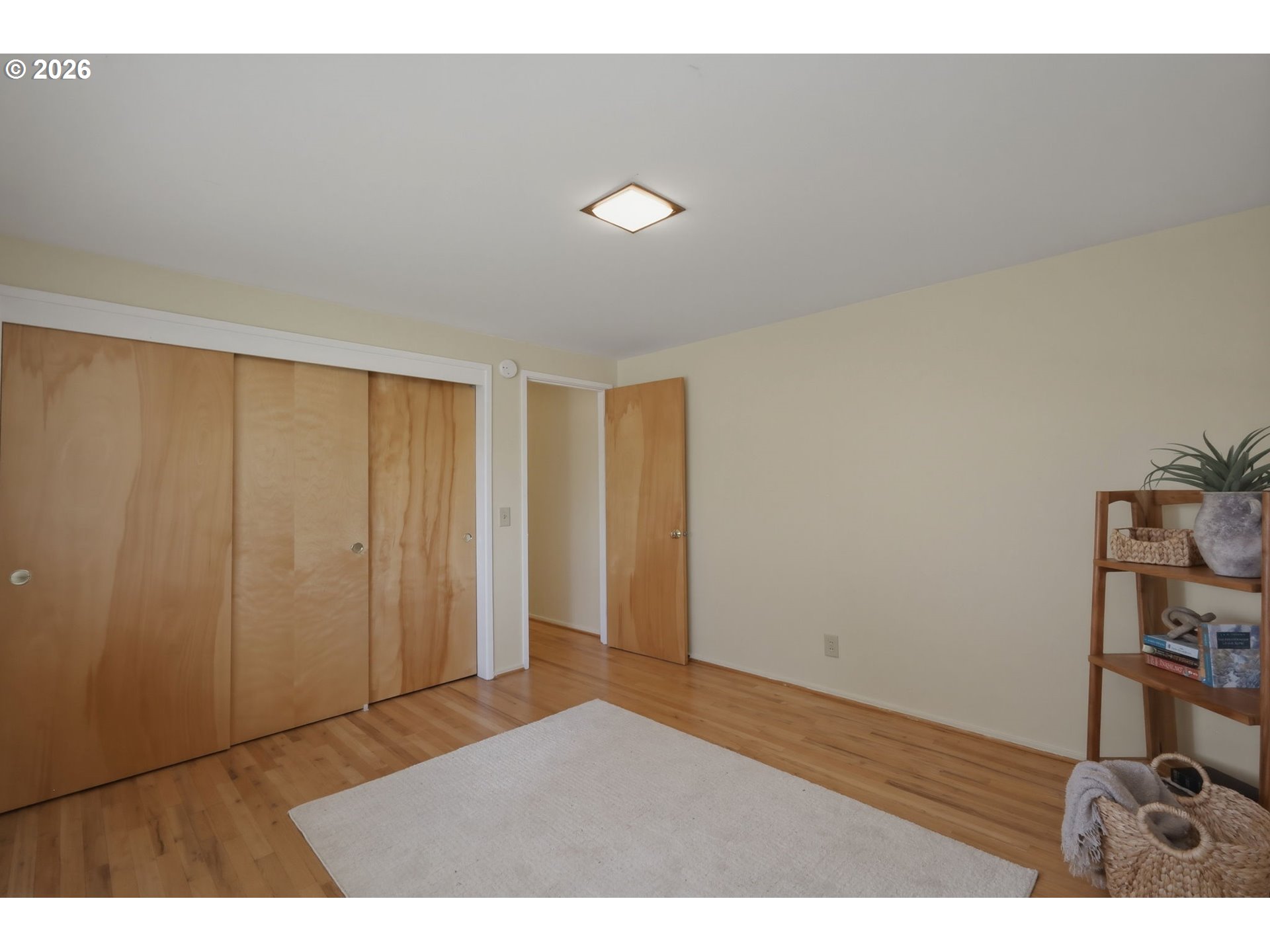 3025 Harris Street Eugene, OR 97405 - Photo 24 of 44 a view of an empty room with wooden floor