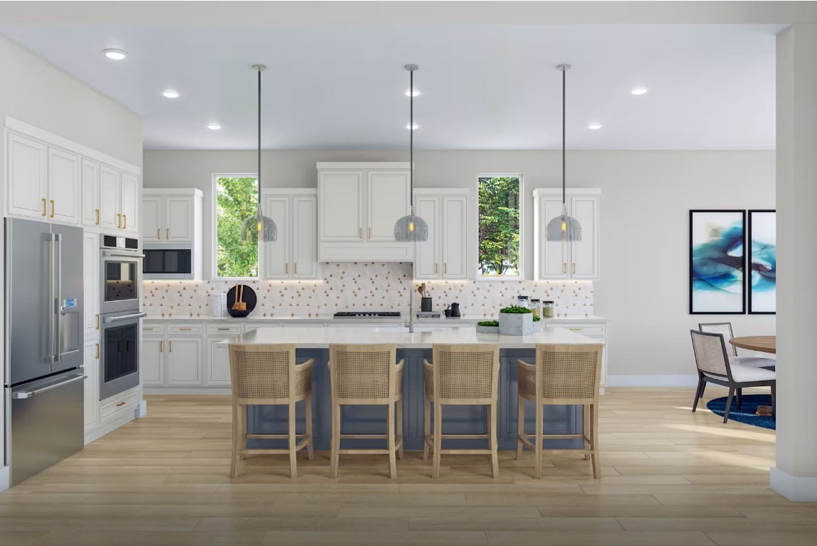 11931 Golden Cove Rosharon, TX 77583 - Photo 6 of 14 a kitchen with stainless steel appliances kitchen island granite countertop a dining table chairs and white cabinets