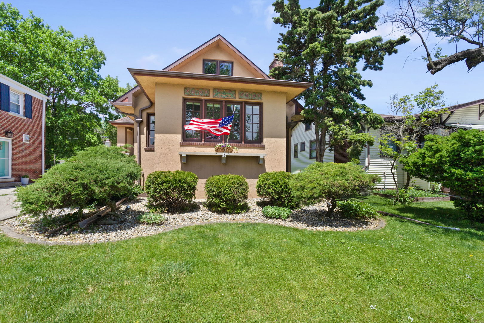 a front view of a house with yard