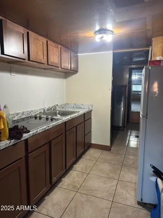 a kitchen with a sink and cabinets