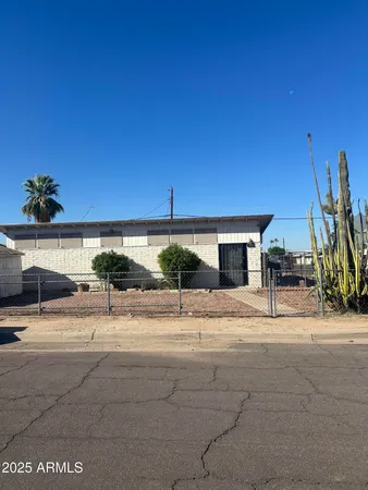 a view of a terrace with a table and chairs