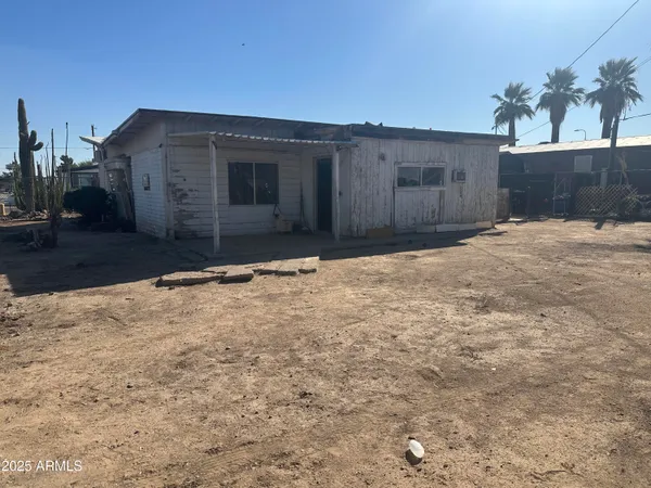 a view of a backyard of the house