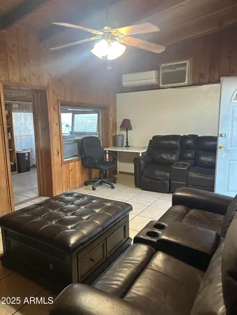 a living room with furniture and a rug