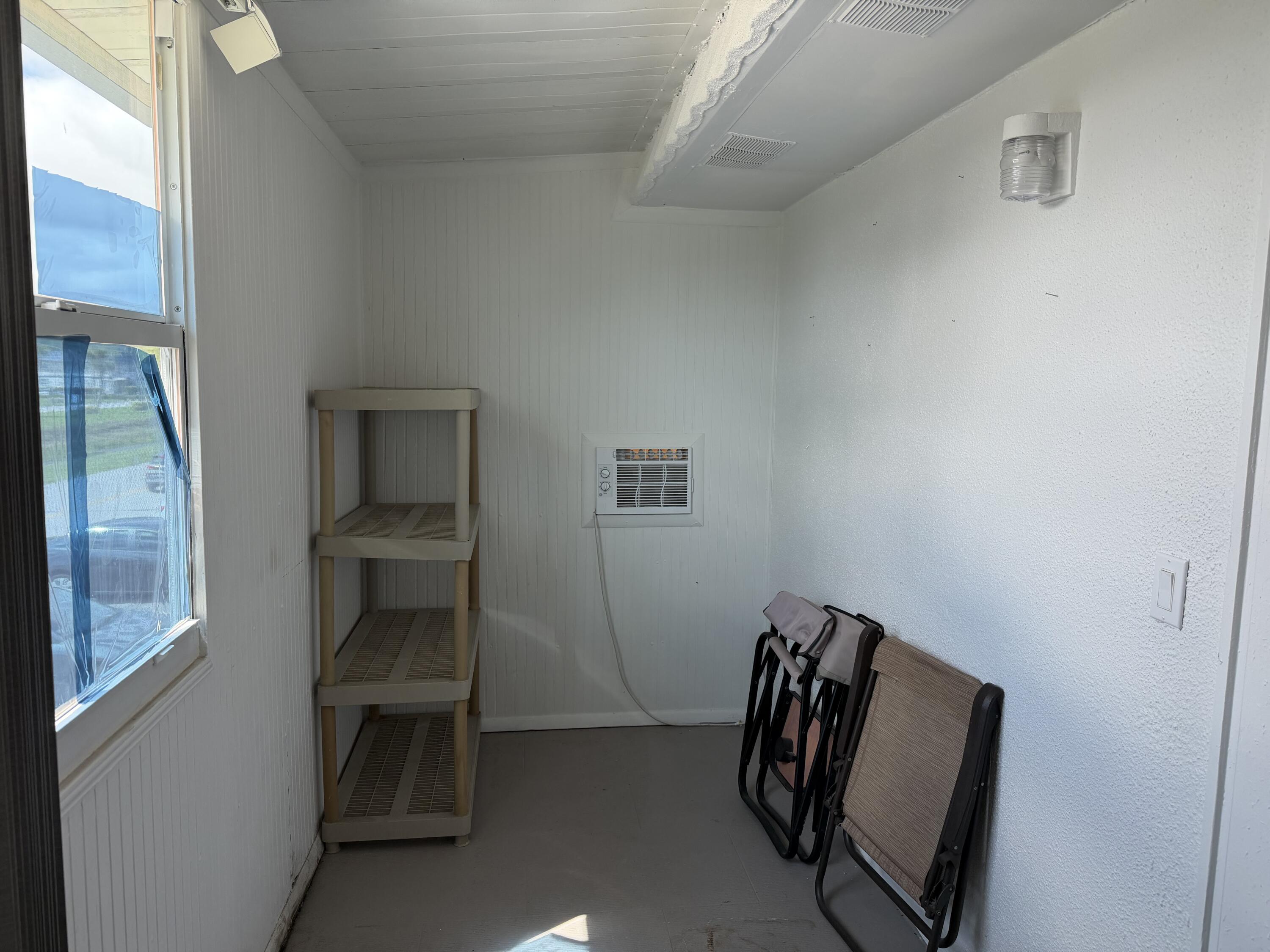 335 Tuscany Lane, Unit 335 Delray Beach, FL 33446 - Photo 11 of 15 a view of entryway with wooden floor