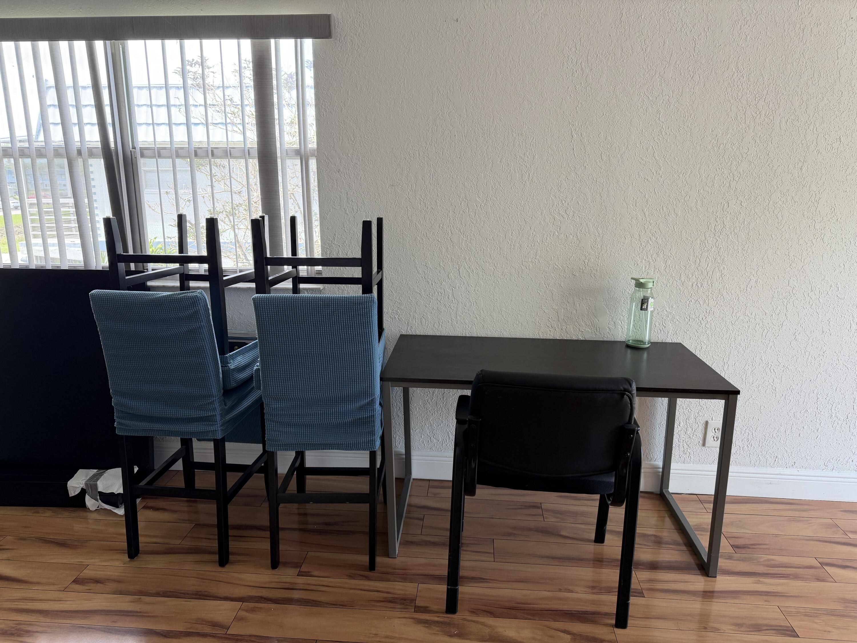 335 Tuscany Lane, Unit 335 Delray Beach, FL 33446 - Photo 5 of 15 a dining room with furniture and wooden floor