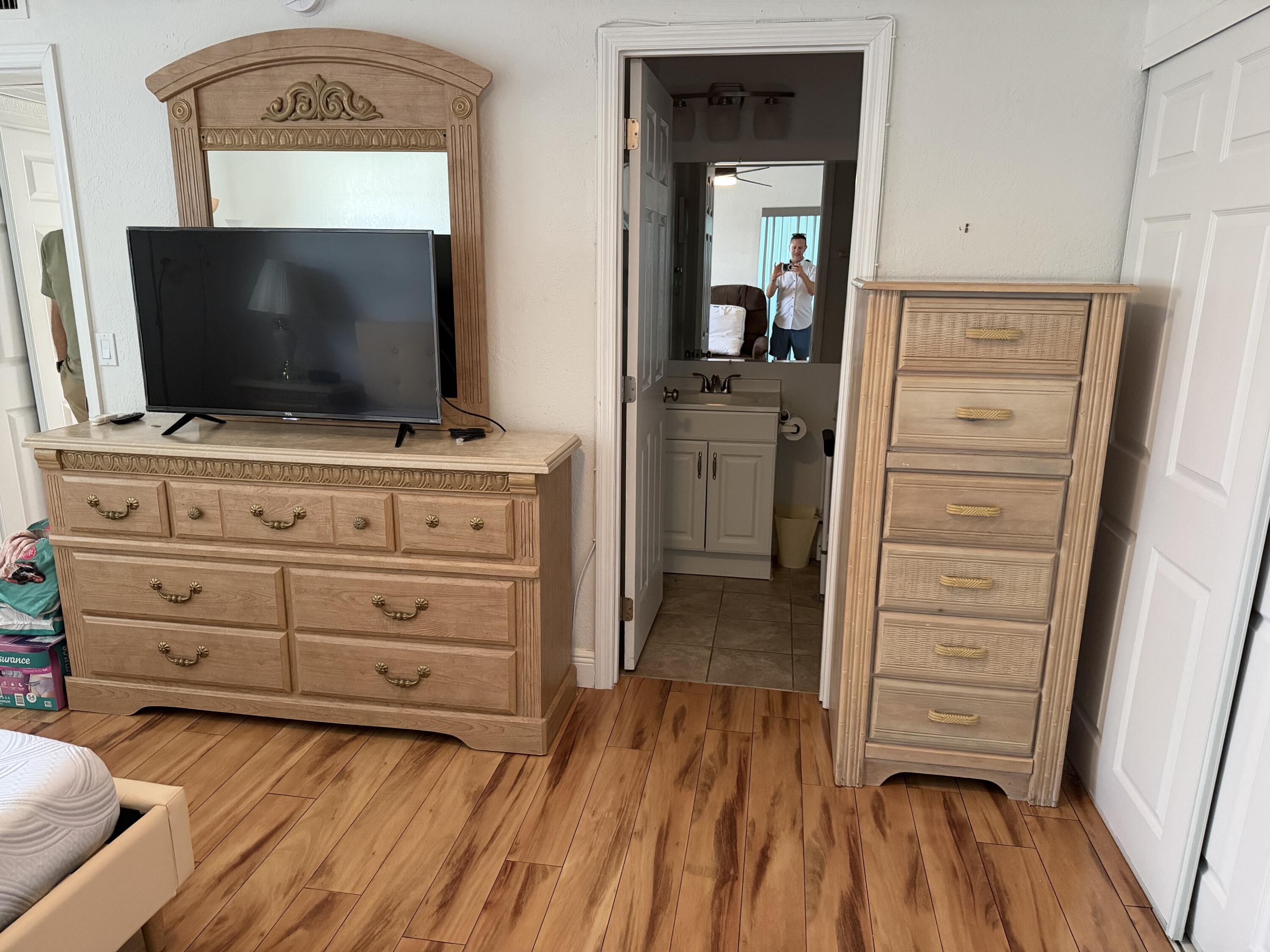 335 Tuscany Lane, Unit 335 Delray Beach, FL 33446 - Photo 8 of 15 a living room with furniture and flat screen tv