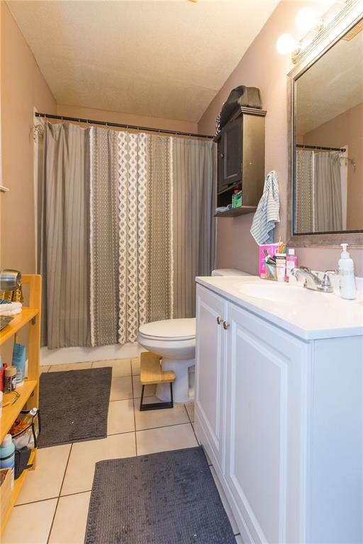 2322 West Cherry Street Tampa, FL 33607 - Photo 36 of 36 a bathroom with a sink a vanity and a mirror