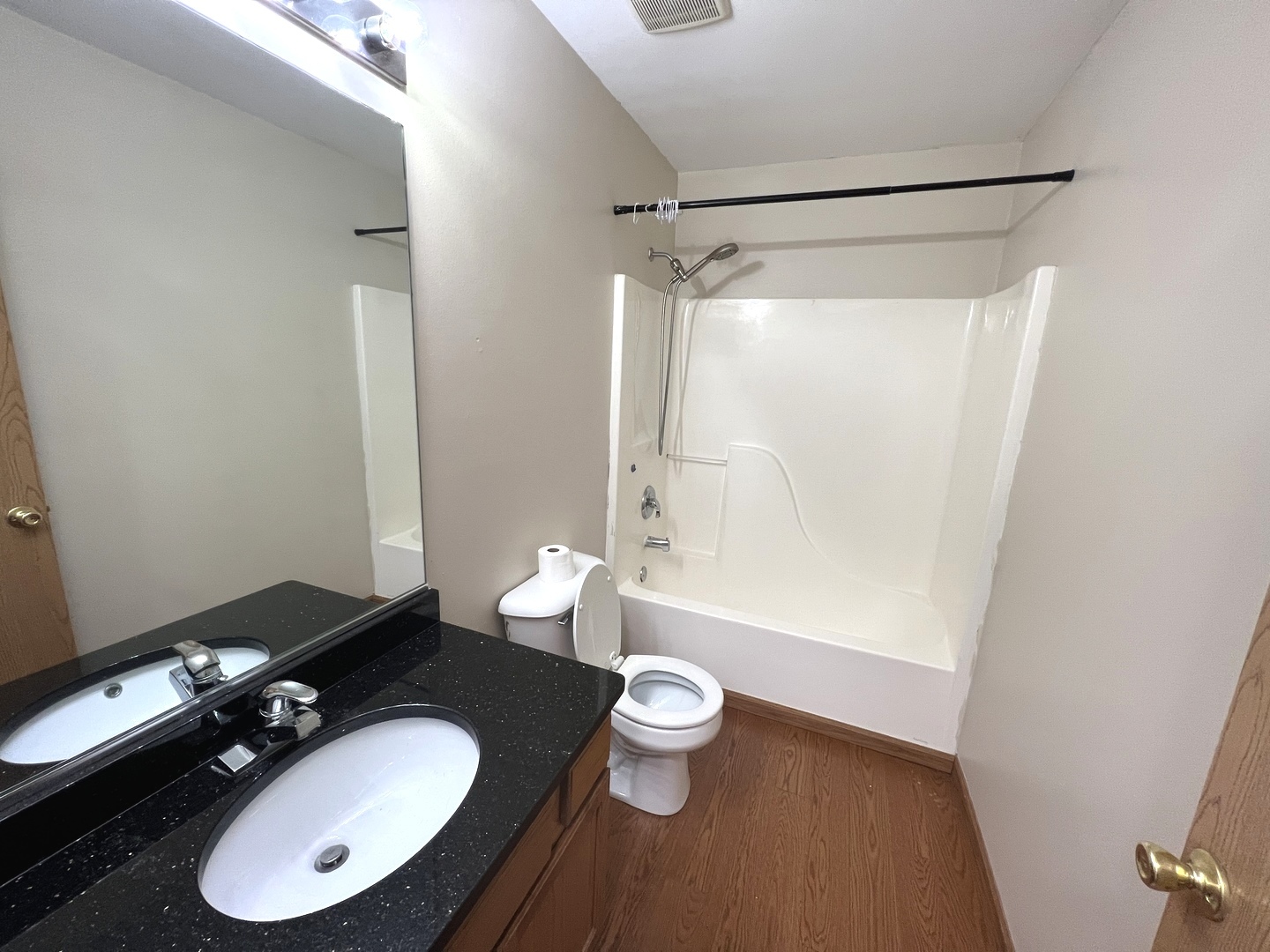 1301 Brookfield Drive Plainfield, IL 60586 - Photo 14 of 25 a bathroom with a sink a toilet a mirror and shower