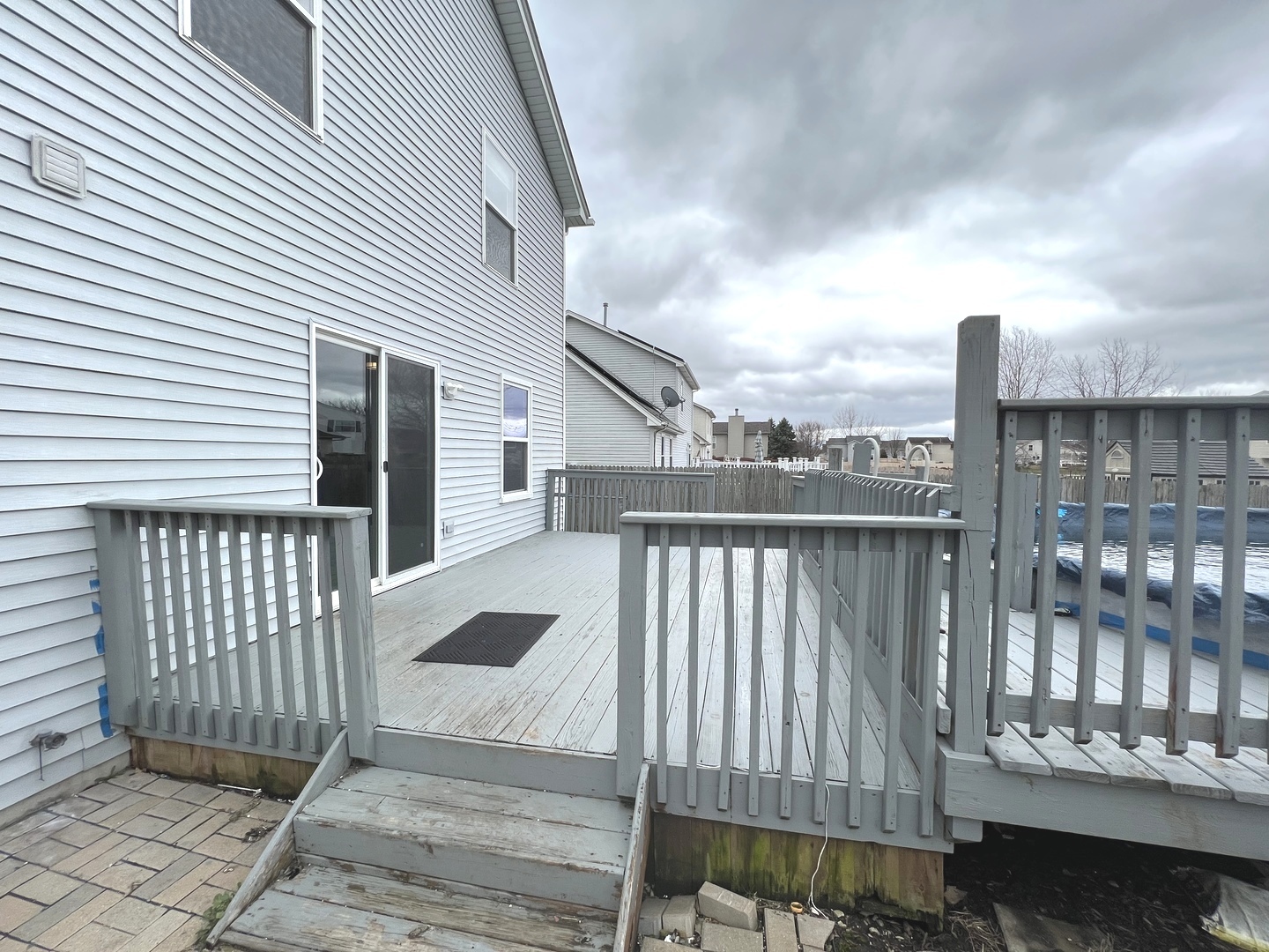 1301 Brookfield Drive Plainfield, IL 60586 - Photo 24 of 25 a view of a balcony with wooden floor and fence