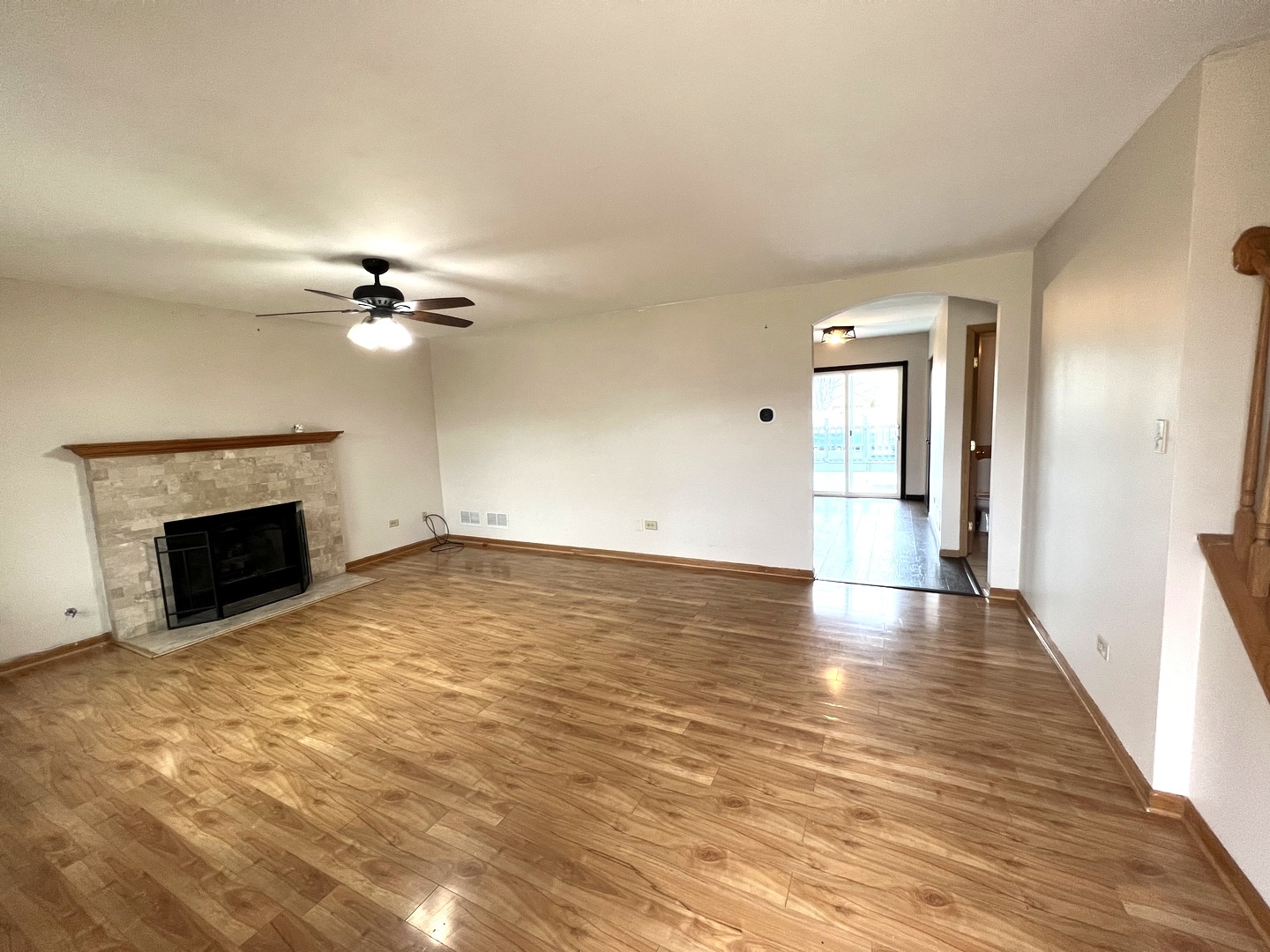 1301 Brookfield Drive Plainfield, IL 60586 - Photo 3 of 25 a view of empty room with wooden floor and fireplace