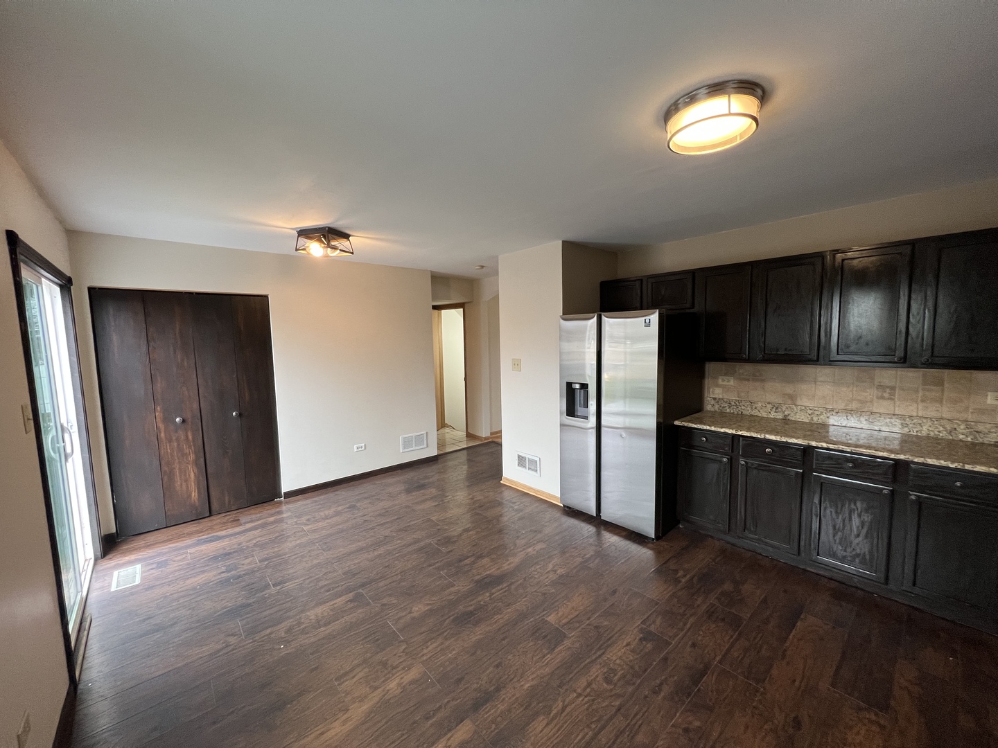 1301 Brookfield Drive Plainfield, IL 60586 - Photo 7 of 25 a kitchen with granite countertop stainless steel appliances and wooden cabinets