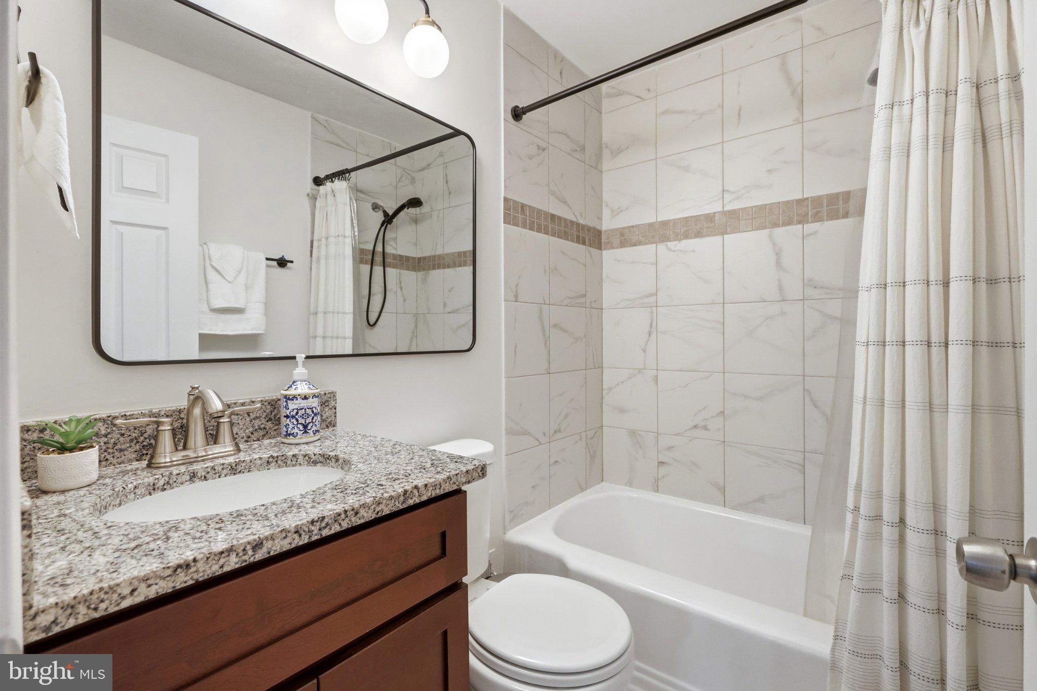 10419 Grandin Road Silver Spring, MD 20902 - Photo 19 of 44 Modern bathroom with elegant finishes.