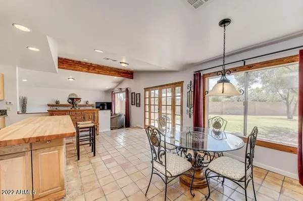 a view of a dining room with furniture window and outside view