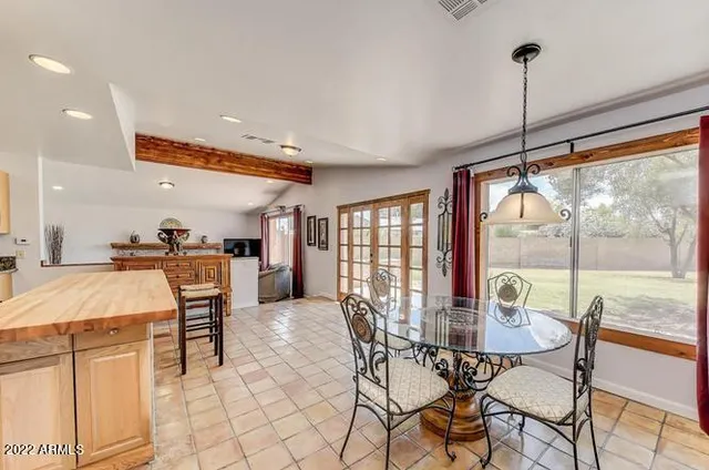 a view of a dining room with furniture window and outside view