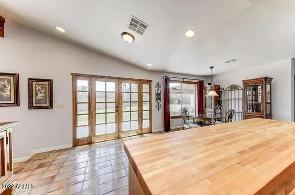 a large bedroom with a bed and large windows