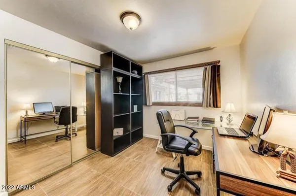 a workspace with furniture hardwood and a window