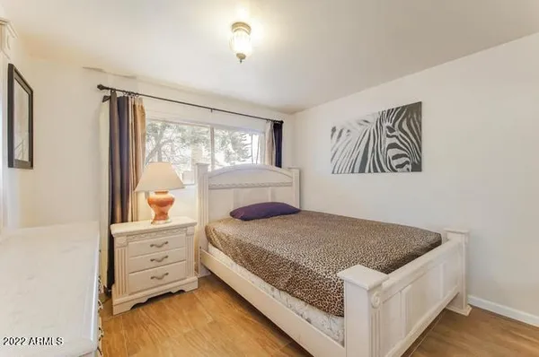 a bedroom with a bed and window