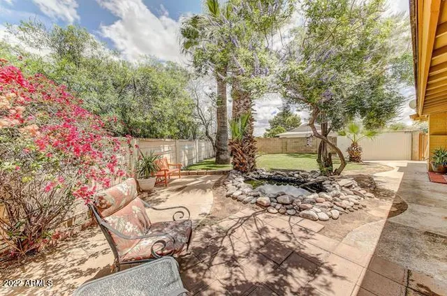 a backyard of a house with lots of green space