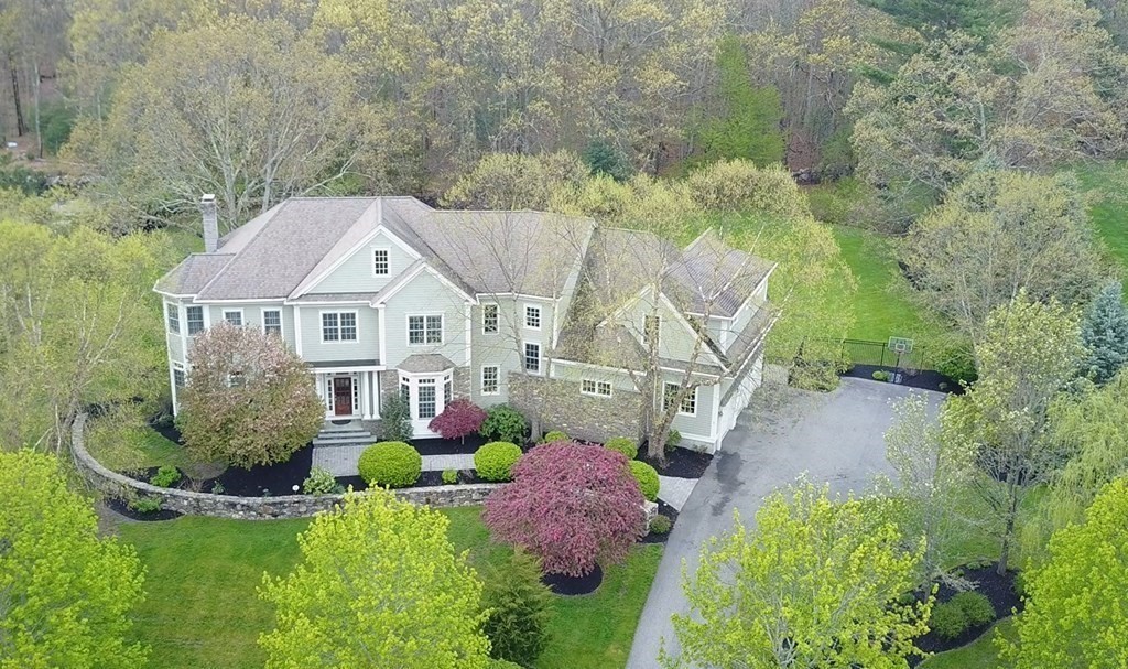 8 Stonegate Lane Dover, MA 02030 - Photo 1 of 42 a aerial view of a house with a yard and potted plants