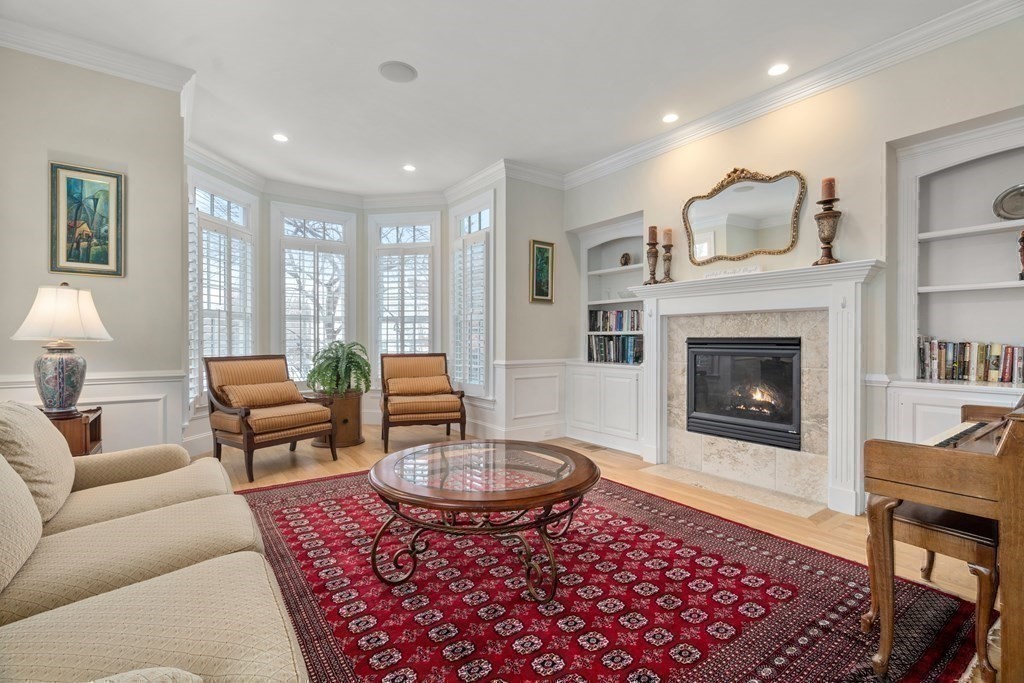 8 Stonegate Lane Dover, MA 02030 - Photo 16 of 42 a living room with furniture and a fireplace
