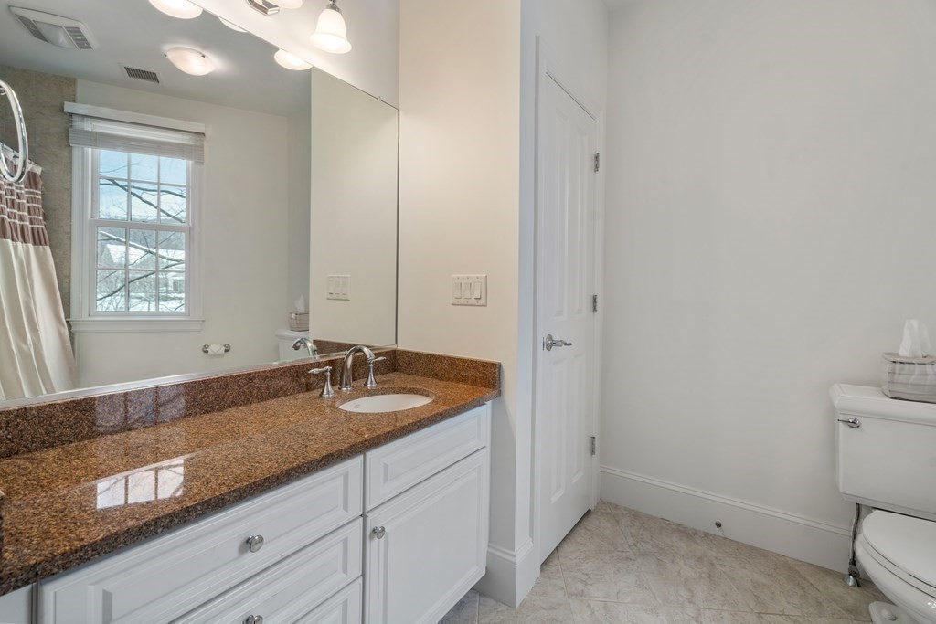 8 Stonegate Lane Dover, MA 02030 - Photo 27 of 42 a bathroom with a granite countertop sink and mirror with window