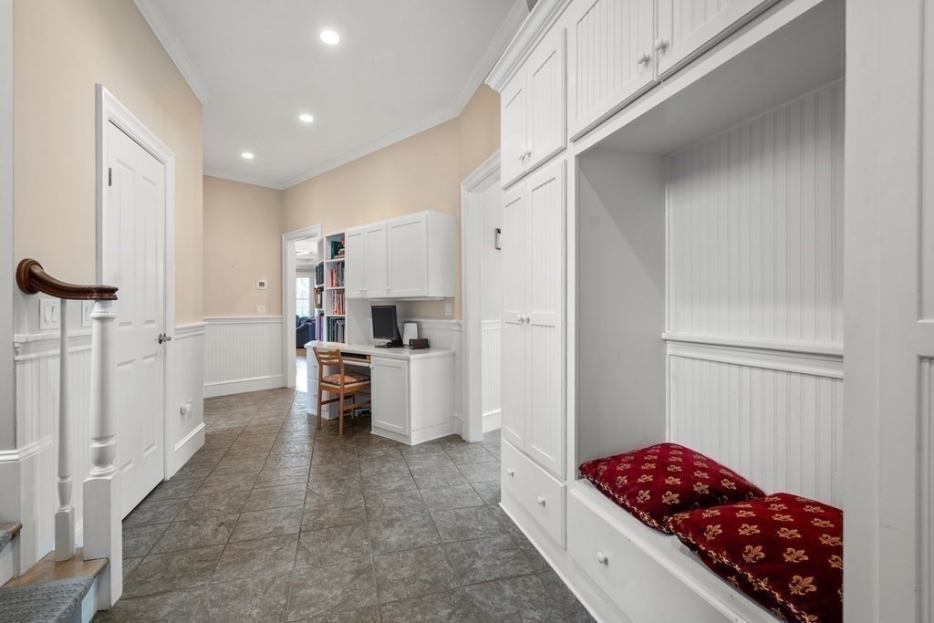 8 Stonegate Lane Dover, MA 02030 - Photo 35 of 42 a kitchen with stainless steel appliances kitchen island granite countertop a refrigerator and a sink