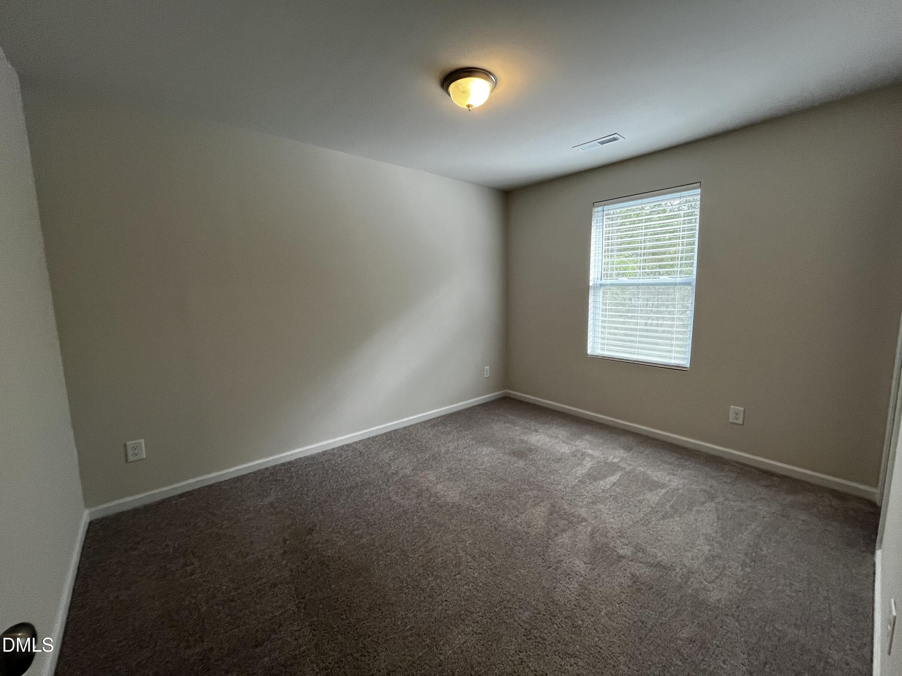 46 East Boulder Road Henderson, NC 27537 - Photo 12 of 15 an empty room with windows