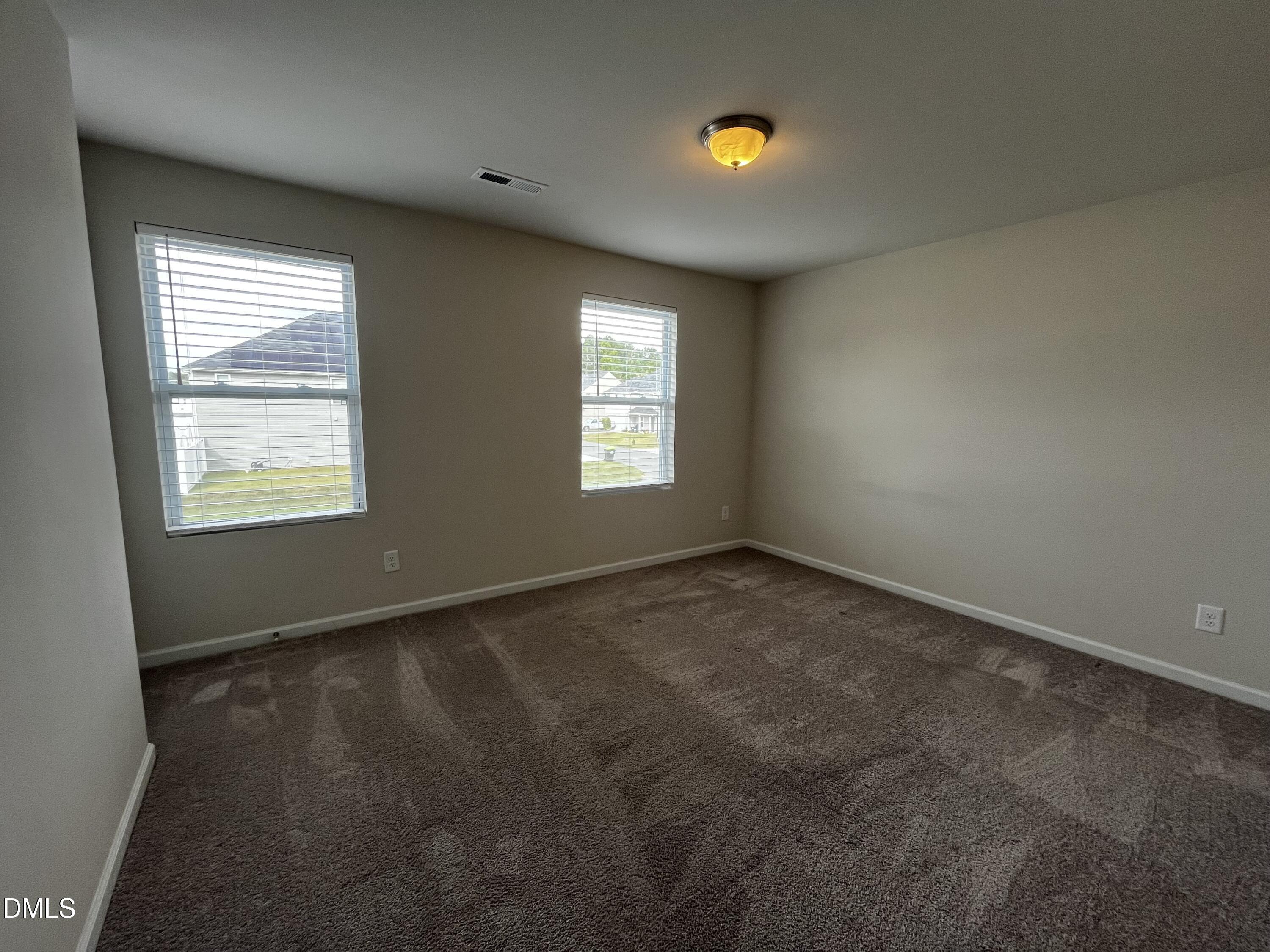 46 East Boulder Road Henderson, NC 27537 - Photo 13 of 15 an empty room with windows