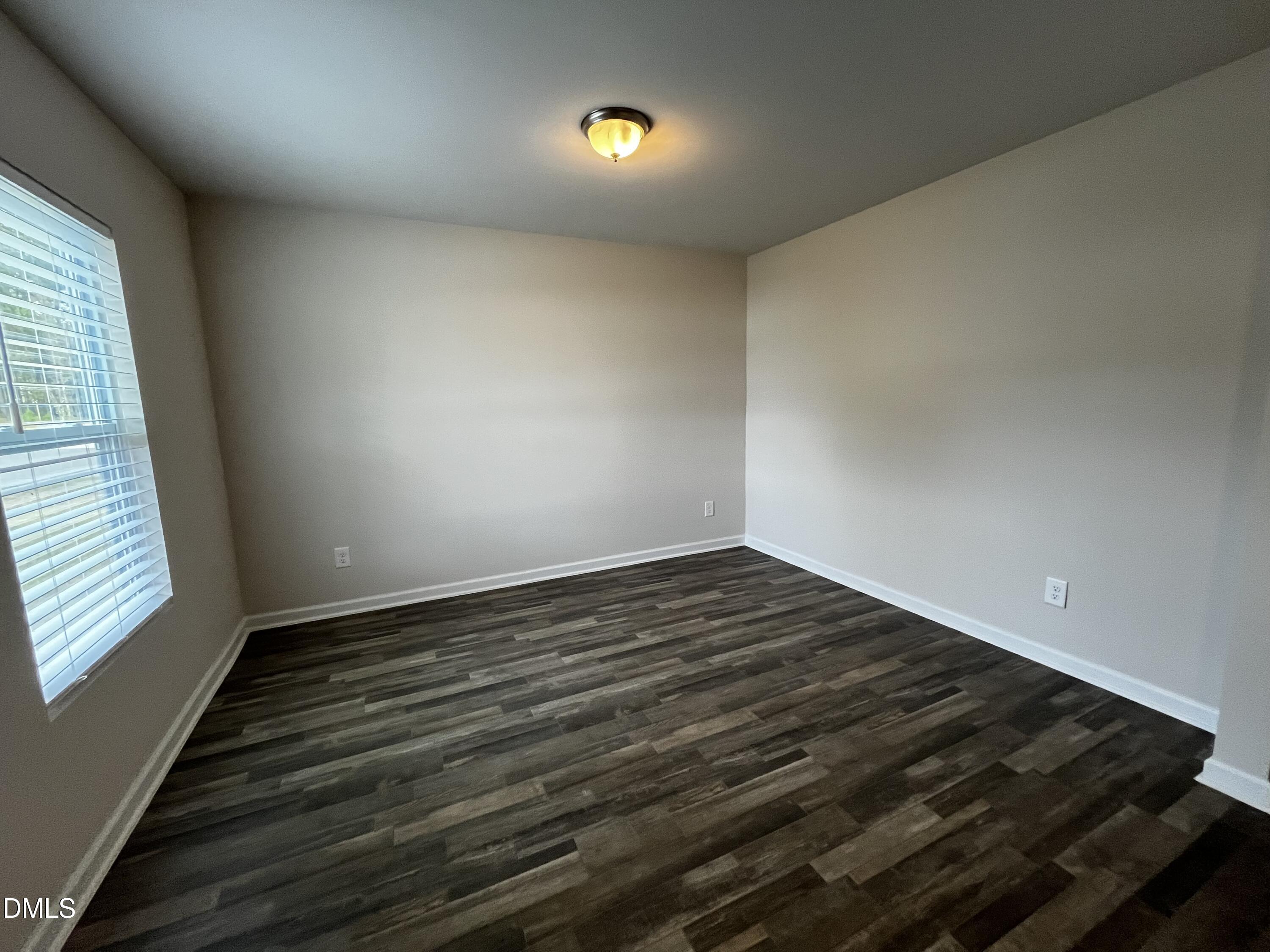46 East Boulder Road Henderson, NC 27537 - Photo 2 of 15 a view of an empty room and window