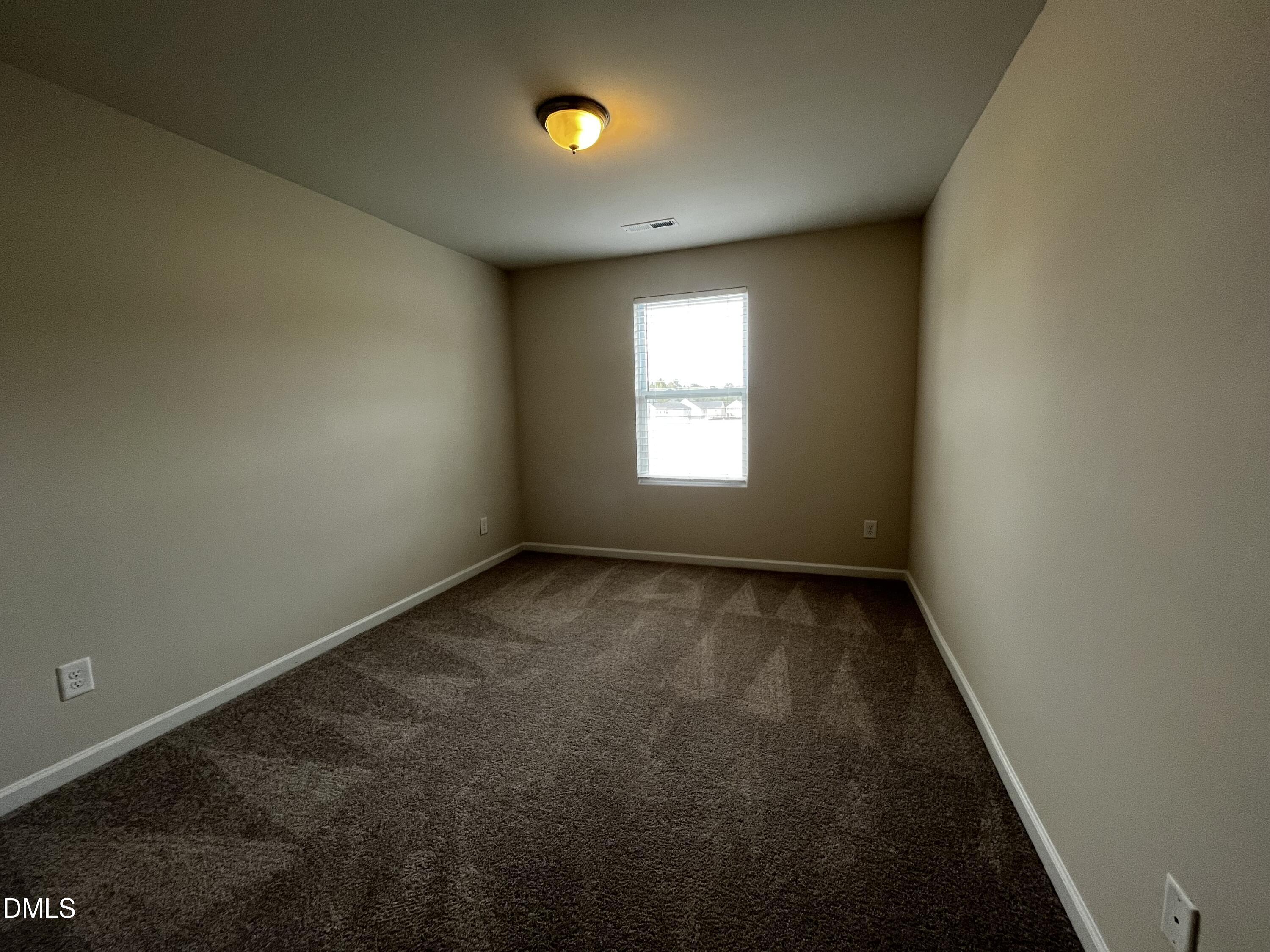 46 East Boulder Road Henderson, NC 27537 - Photo 7 of 15 a view of an empty room with a window