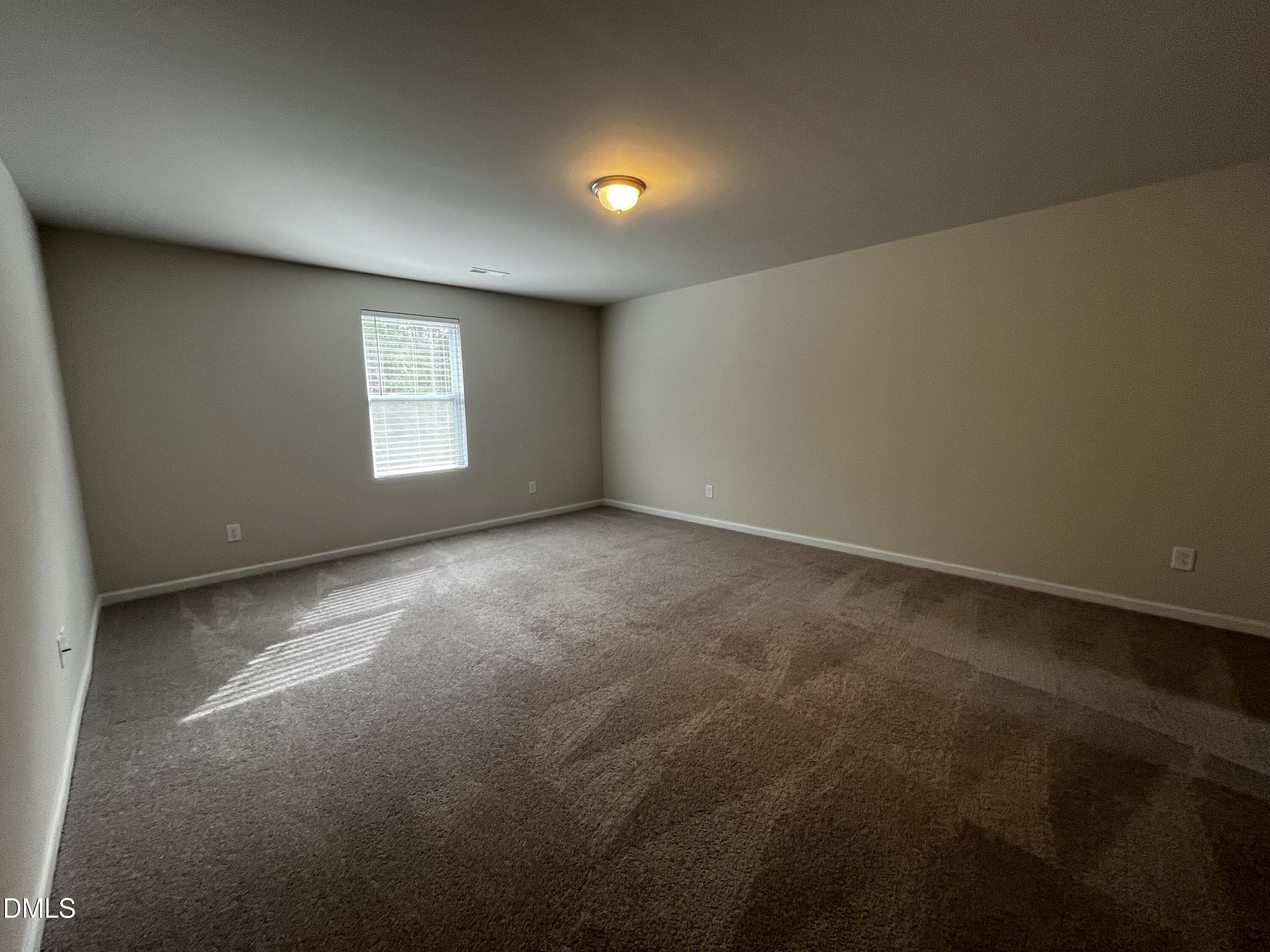 46 East Boulder Road Henderson, NC 27537 - Photo 8 of 15 an empty room with a window