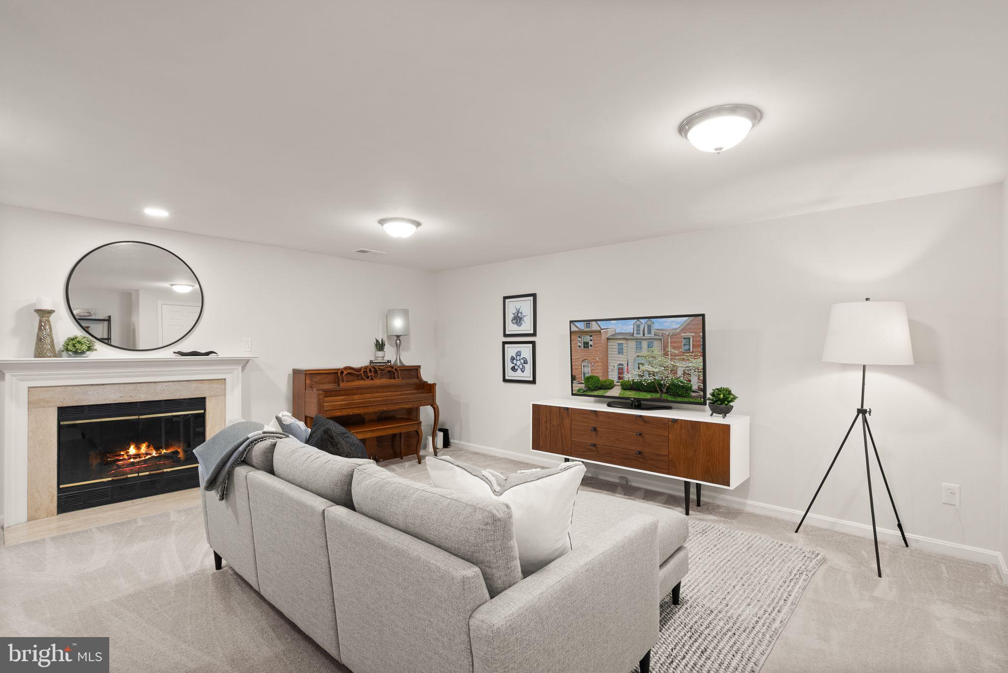 6369 English Ivy Way Springfield, VA 22152 - Photo 23 of 62 a living room with furniture and a fireplace