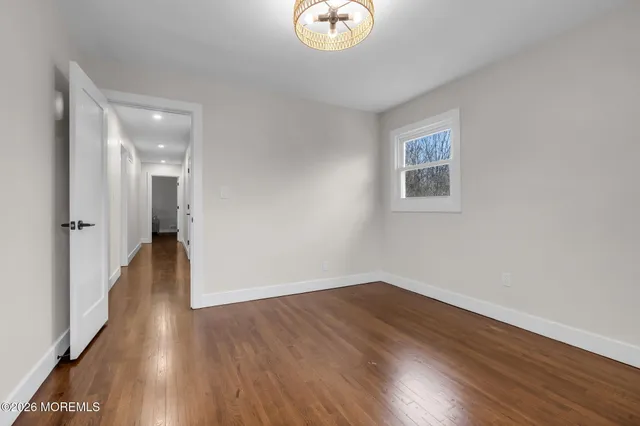 a view of a livingroom with wooden floor