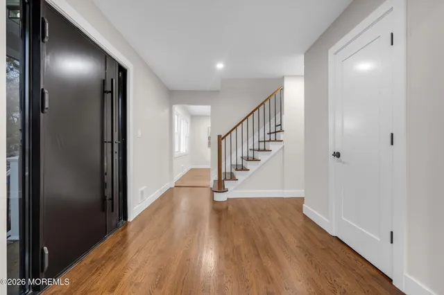 a view of entryway with wooden floor