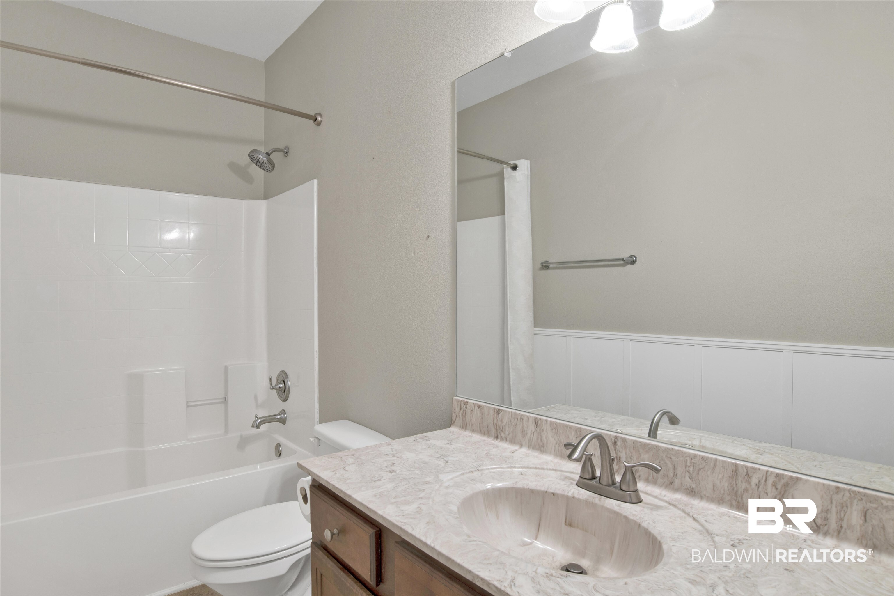 24159 Tullamore Drive Daphne, AL 36526 - Photo 18 of 31 Full bathroom featuring vanity, shower / tub combo with curtain, and toilet