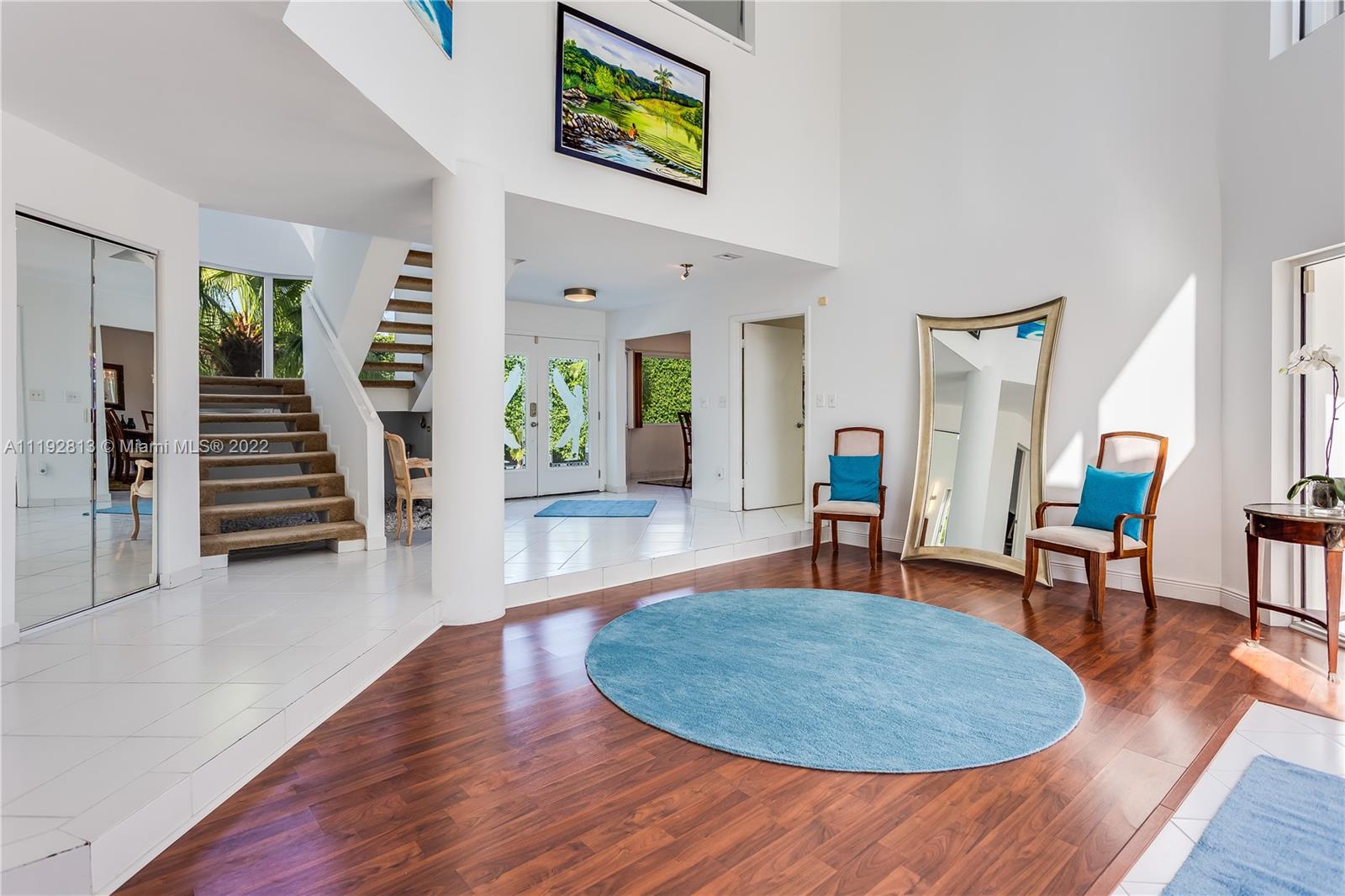 6180 Pine Tree Drive Miami Beach, FL 33140 - Photo 15 of 32 a living room with furniture and wooden floor