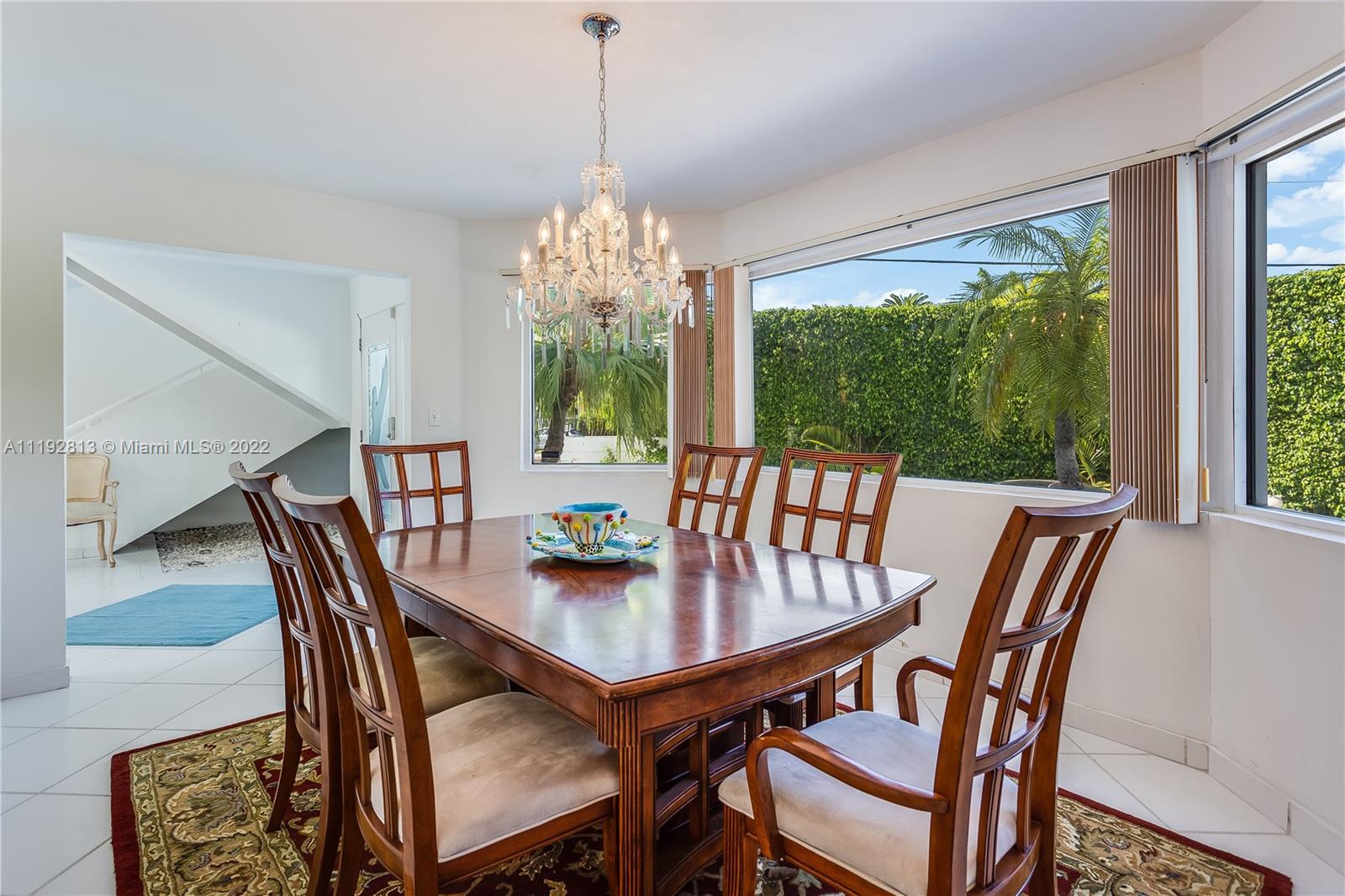 6180 Pine Tree Drive Miami Beach, FL 33140 - Photo 23 of 32 a view of a dining room with furniture window and outside view