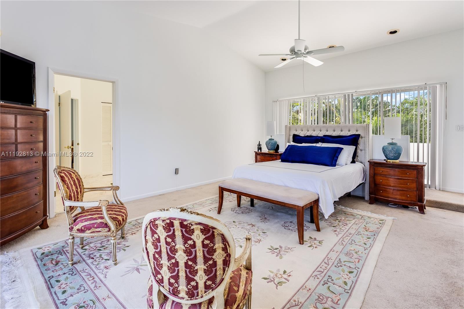 6180 Pine Tree Drive Miami Beach, FL 33140 - Photo 24 of 32 a living room with furniture and a flat screen tv
