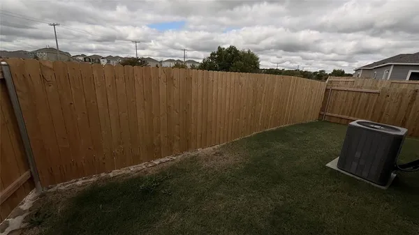 a kitchen with kitchen island stainless steel appliances a sink stove and refrigerator