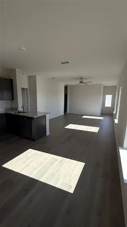 a view of a kitchen with furniture and a window